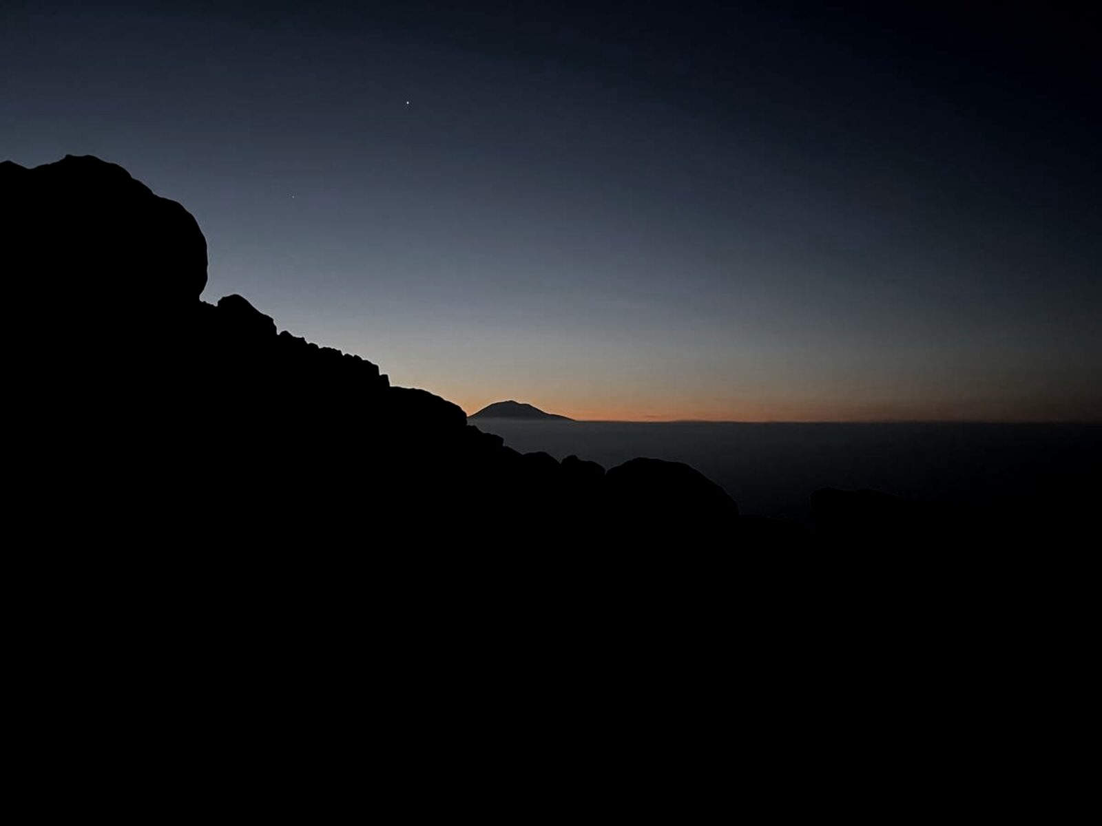 Mt. Adams seen from Mt. St. Helens at dawn, sunlit summit profile